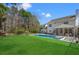Beautiful backyard with an in-ground pool, lush lawn, and a fence at 2900 Colonnade Dr, Mount Pleasant, SC 29466