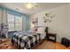Comfortable bedroom featuring a ceiling fan, natural light from the window and hardwood floors at 2900 Colonnade Dr, Mount Pleasant, SC 29466