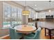 Bright breakfast area with a pool view and modern lighting fixture at 2900 Colonnade Dr, Mount Pleasant, SC 29466