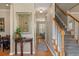 Warm and inviting entryway with hardwood floors, staircase, and elegant decor at 2900 Colonnade Dr, Mount Pleasant, SC 29466