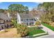 The exterior features a manicured lawn, mature trees, and a welcoming front porch at 2900 Colonnade Dr, Mount Pleasant, SC 29466
