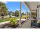 Covered porch with white columns and comfortable outdoor seating, perfect for relaxing at 2900 Colonnade Dr, Mount Pleasant, SC 29466