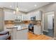 Updated kitchen featuring white cabinets, granite countertops, stainless appliances, and wood floors at 2900 Colonnade Dr, Mount Pleasant, SC 29466