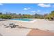 Large community pool with ample lounge chairs and patio furniture on a sunny day at 2900 Colonnade Dr, Mount Pleasant, SC 29466