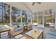 Screened-in porch with patio furniture and view of the pool and backyard at 2900 Colonnade Dr, Mount Pleasant, SC 29466