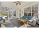 Enclosed porch with blue sofa and chairs overlooking lush backyard at 2900 Colonnade Dr, Mount Pleasant, SC 29466