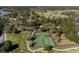 Aerial view featuring tennis courts surrounded by scenic greenery, ponds and walking trails at 3019 Eventide Dr, Johns Island, SC 29455