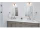 Elegant bathroom boasts double sinks, quartz countertop, and a large framed mirror at 3019 Eventide Dr, Johns Island, SC 29455