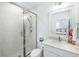 Bright bathroom featuring a glass shower, white vanity, and a modern design with white tile at 3019 Eventide Dr, Johns Island, SC 29455