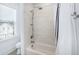 Bathroom with tiled shower and tub featuring white subway tiles, with neutral tile floors at 3019 Eventide Dr, Johns Island, SC 29455
