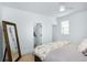 Bedroom featuring ceiling fan, closet, ensuite bathroom, large bed and cozy comforter at 3019 Eventide Dr, Johns Island, SC 29455