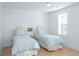 Bedroom with two twin beds, natural light, and hardwood floors at 3019 Eventide Dr, Johns Island, SC 29455