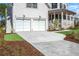 Beautiful home featuring a two-car garage, covered front porch, and landscaped front yard at 3019 Eventide Dr, Johns Island, SC 29455