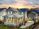 Beautiful two-story home with a welcoming front porch, well-lit exterior, and a driveway at 3019 Eventide Dr, Johns Island, SC 29455