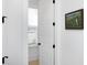 Bright hallway with white walls, modern door hardware and view to the outside at 3019 Eventide Dr, Johns Island, SC 29455