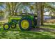 Antique John Deere tractor displayed near Rosebank Farms sign and picnic tables, a nod to rural heritage at 3019 Eventide Dr, Johns Island, SC 29455