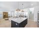 Open concept kitchen with center island, stainless appliances, and seamless access to the living area at 3019 Eventide Dr, Johns Island, SC 29455