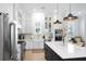 Well-lit kitchen featuring a large island, modern appliances, and ample cabinet space at 3019 Eventide Dr, Johns Island, SC 29455