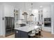 Beautiful kitchen with a large island, stainless steel appliances, and modern pendant lights at 3019 Eventide Dr, Johns Island, SC 29455