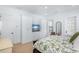 The main bedroom includes hardwood floors, recessed lighting, built in wardrobe cabinets and outside views at 3019 Eventide Dr, Johns Island, SC 29455