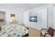 A well-lit main bedroom boasts hardwood floors, a ceiling fan, and built in wardrobe cabinets at 3019 Eventide Dr, Johns Island, SC 29455