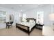 Bright main bedroom with panelled walls, ceiling fan, neutral toned decor, and two windows at 3019 Eventide Dr, Johns Island, SC 29455