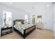 A stylish main bedroom featuring neutral decor, hardwood floors, and recessed lighting at 3019 Eventide Dr, Johns Island, SC 29455