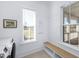 Bright mudroom features built-in bench, modern washer and dryer, and neutral paint palette at 3019 Eventide Dr, Johns Island, SC 29455