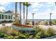 Charming outdoor setting with a boat, palm trees, and stylish seating, perfect for relaxing by the water at 3019 Eventide Dr, Johns Island, SC 29455