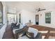 Inviting porch with wicker chairs, plank flooring, and views creating a relaxing outdoor space at 3019 Eventide Dr, Johns Island, SC 29455