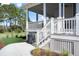 Covered porch with stairs leading to yard, featuring durable decking and a grilling area at 3019 Eventide Dr, Johns Island, SC 29455