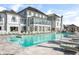 Luxury resort-style pool with ample lounge seating, umbrellas and manicured grounds on a sunny day at 3019 Eventide Dr, Johns Island, SC 29455