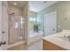 Lovely bathroom features a glass enclosed shower, tub, and double vanity at 303 Crossandra Ave, Summerville, SC 29483
