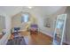 Bright bonus room with wood floors, workout equipment, and natural light at 303 Crossandra Ave, Summerville, SC 29483