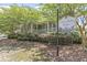 White Gables Club with lush landscaping and a welcoming facade, creating a serene community atmosphere at 303 Crossandra Ave, Summerville, SC 29483