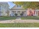 Charming single-Gathering home with a classic covered front porch and manicured front yard at 303 Crossandra Ave, Summerville, SC 29483