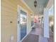 Inviting front porch with a modern door, stylish lighting, and a cozy seating area at 303 Crossandra Ave, Summerville, SC 29483