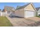 Detached garage with a basketball hoop in the driveway at 303 Crossandra Ave, Summerville, SC 29483