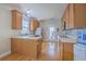 Bright kitchen featuring wood cabinets, countertops, and hardwood flooring at 303 Crossandra Ave, Summerville, SC 29483