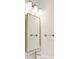 Modern bathroom vanity with gold framed mirror and contemporary lighting at 3148 Vanessa Lynne Ln, Johns Island, SC 29455