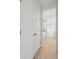 Hallway with closet that opens into a kitchen featuring white cabinets and stainless-steel appliances at 3148 Vanessa Lynne Ln, Johns Island, SC 29455