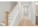Hallway with stairs and hardwood flooring, leading to a bathroom at 3148 Vanessa Lynne Ln, Johns Island, SC 29455