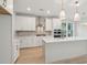 Kitchen with white cabinets, marble countertops, stainless steel appliances, and center island at 3148 Vanessa Lynne Ln, Johns Island, SC 29455