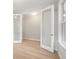 Bright living room with French doors, light wood floors, and neutral paint at 3148 Vanessa Lynne Ln, Johns Island, SC 29455