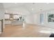 Open concept living room with bright kitchen and a fireplace at 3148 Vanessa Lynne Ln, Johns Island, SC 29455