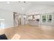 Open concept living room with bright kitchen and staircase at 3148 Vanessa Lynne Ln, Johns Island, SC 29455