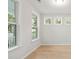 Bright living room with hardwood floors and three large windows at 3148 Vanessa Lynne Ln, Johns Island, SC 29455