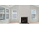 Bright living room with a fireplace and multiple windows at 3148 Vanessa Lynne Ln, Johns Island, SC 29455