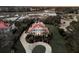 Stunning aerial view of a grand home with a circular driveway, manicured lawn, and waterfront access at 3232 Pignatelli Cres, Mount Pleasant, SC 29466