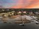 Beautiful aerial view of multi-million dollar waterfront homes and golf course at sunset at 3232 Pignatelli Cres, Mount Pleasant, SC 29466